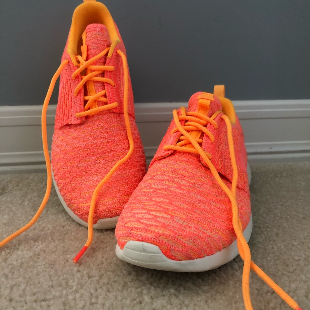 Nike, bright orange trainers.